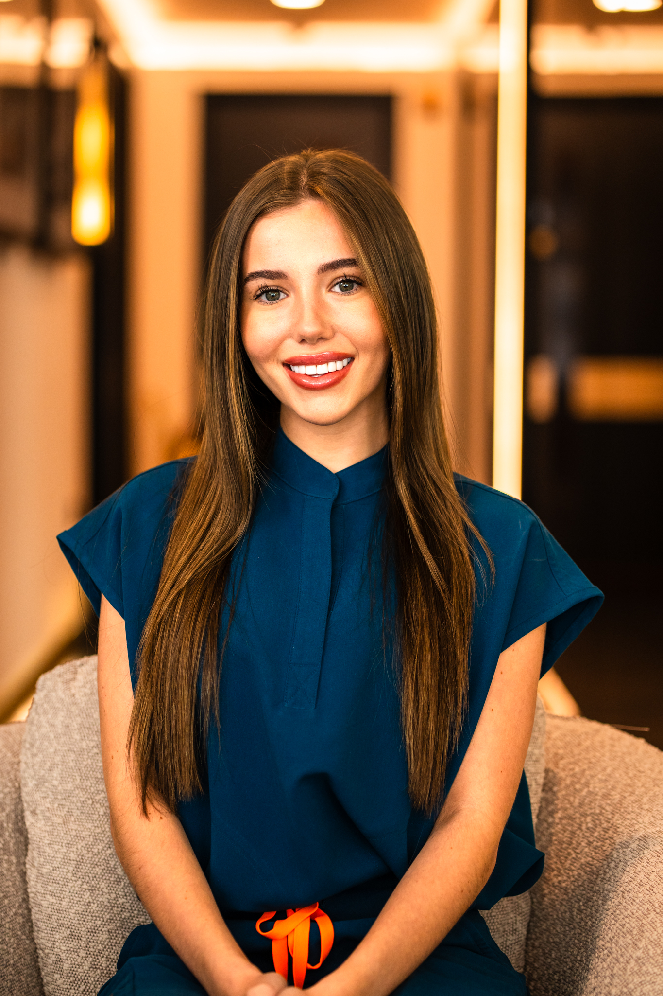 Dental Nurse Aimee Cassidy wearing smart blue scrubs