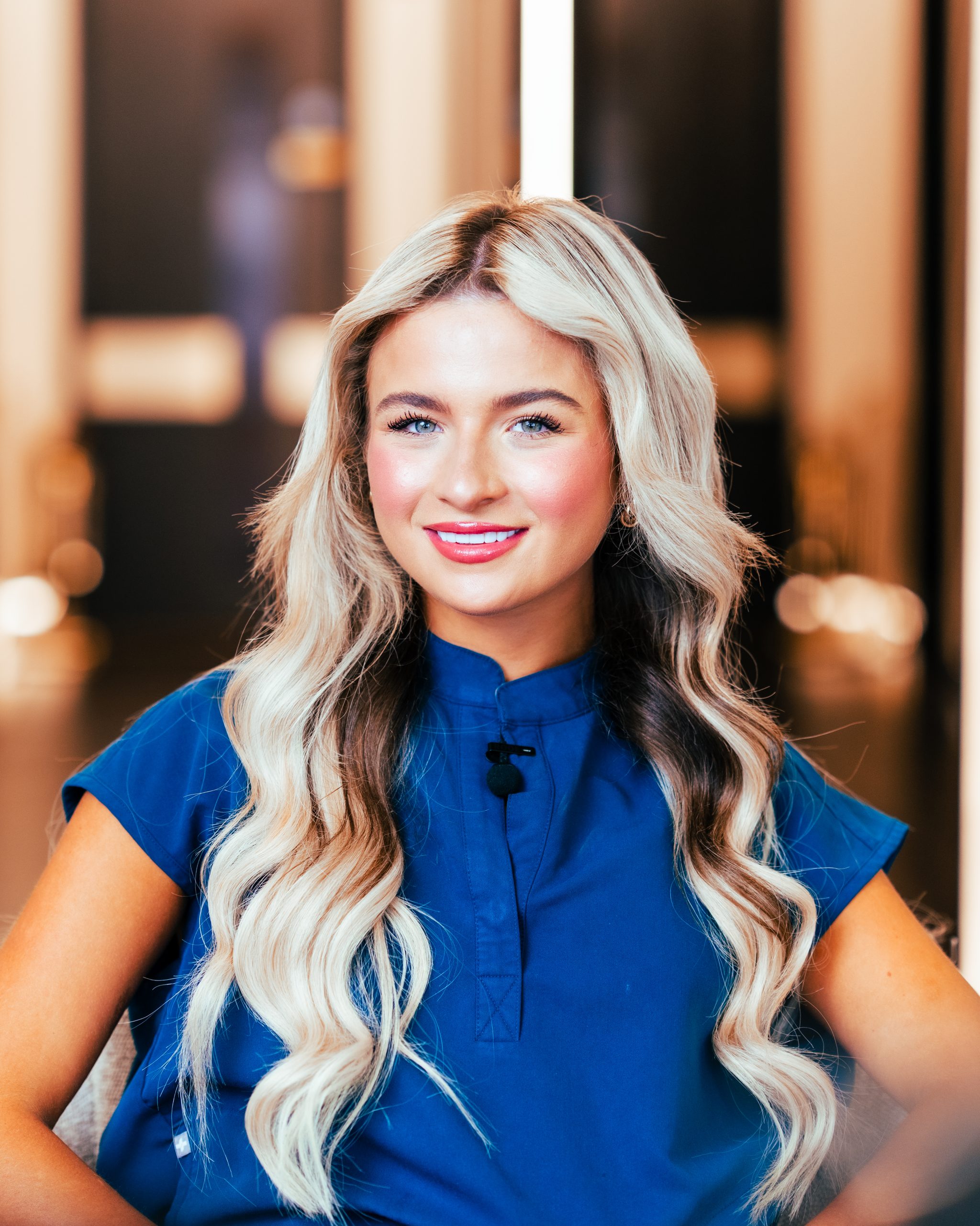 Dental Nurse Harriet Guy wearing deep blue scrubs