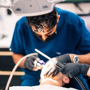 Kamran Rasul performing dental treamtent